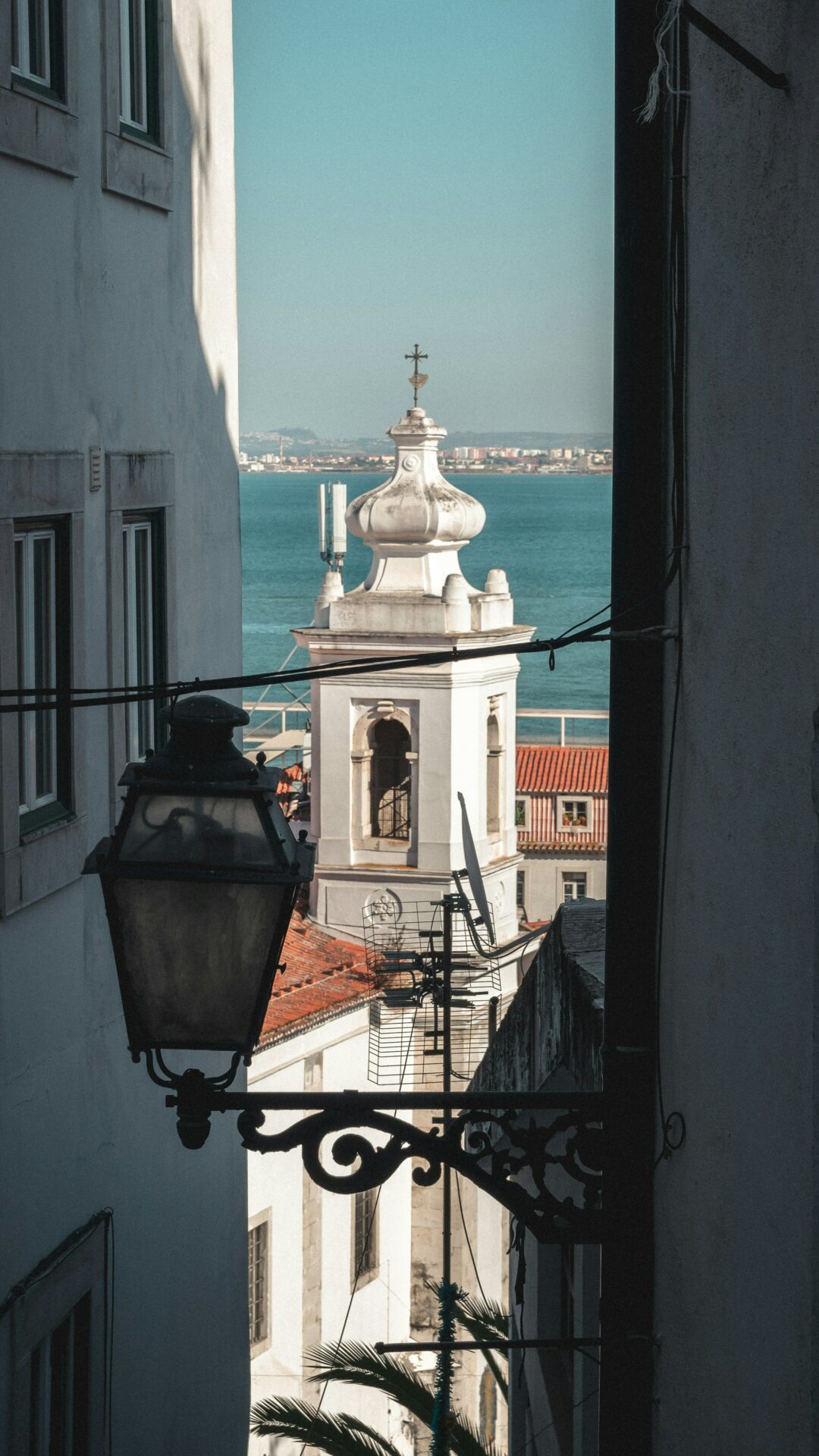 Aerial view of Lisbon’s riverside neighborhoods at golden hour