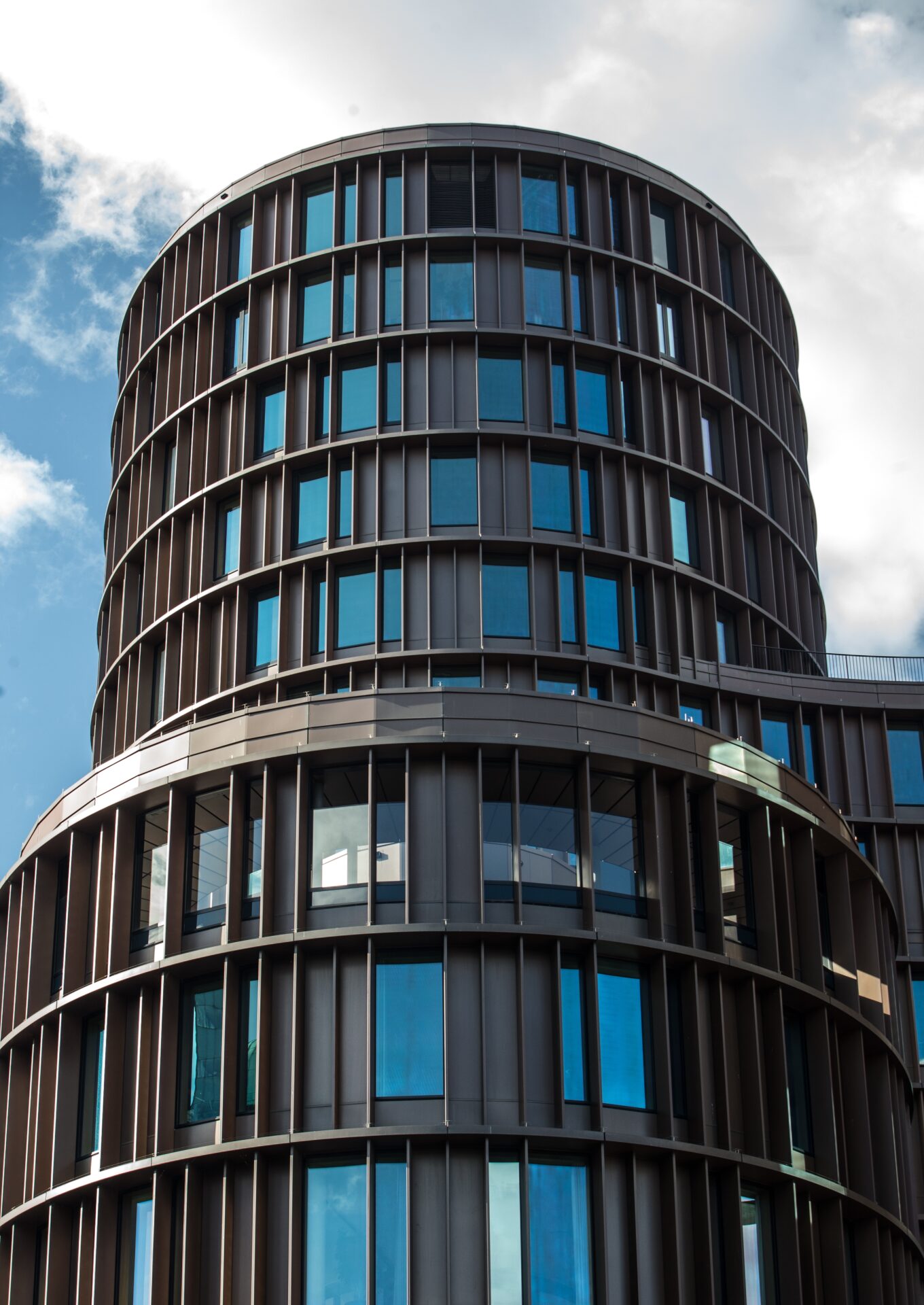 Modern glass office building in Lisbon representing institutional real estate in Portugal